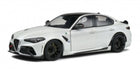 White 1:18 scale diecast model car with black accents, sporty design, black wheels