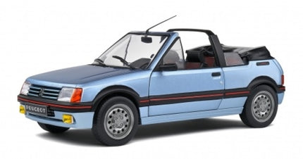 1:18 scale diecast model of a blue Peugeot 205 Cabriolet with detailed exterior.