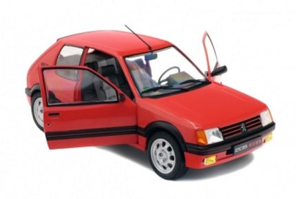 Red diecast model car with two open front doors, detailed wheels, and realistic interior.