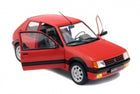 Red diecast model car with two open front doors, detailed wheels, and realistic interior.