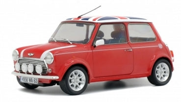 Red diecast classic Mini Cooper model car with Union Jack roof, 1:18 scale collectible