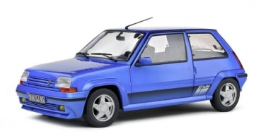 1:18 scale blue diecast model car with sporty design and detailed exterior on white background