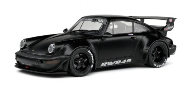 Black diecast 1:18 scale Porsche RWB model car with wide body kit and large rear wing