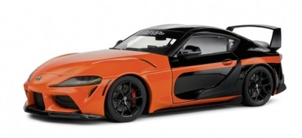 1:18 scale orange and black diecast model sports car with rear spoiler