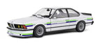 1:18 scale diecast model of classic white coupe with racing stripes and detailed wheels