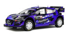 1:18 scale diecast rally car model, blue and black Ford with racing decals and spoilers