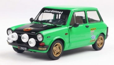 1:18 scale diecast green rally car model with hood lights and race decals