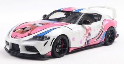 1:18 scale diecast Toyota Supra model car, white with pink anime-themed graphics and black wheels
