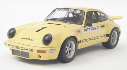 Yellow diecast Porsche model car with racing decals and Fittipaldi on windshield