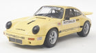 Yellow diecast Porsche model car with racing decals and Fittipaldi on windshield