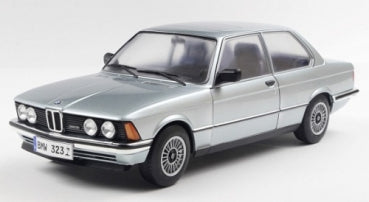 1:18 scale silver BMW 323i diecast model car with detailed wheels and classic design