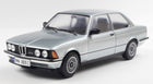 1:18 scale diecast silver BMW 323i model car with realistic detailing, displayed on white background