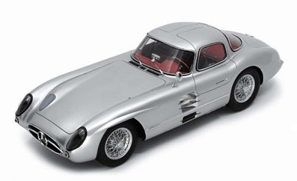 Silver diecast model car in 1:18 scale with red interior, classic coupe design