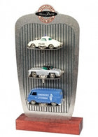 Diecast model car set display with vintage police car, sports car, and blue service van