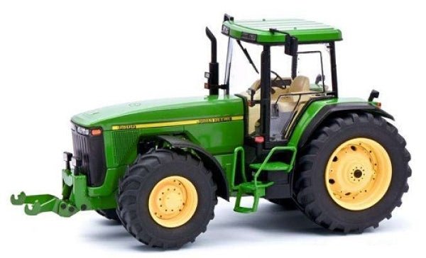 Green diecast model tractor with yellow wheels, detailed cab and realistic features