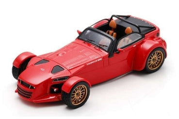 Red diecast model sports car in 1:18 scale with gold wheels and tan interior.