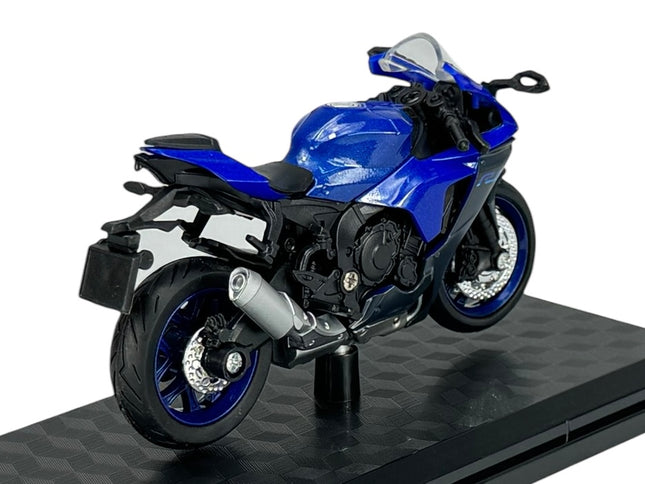 Blue diecast model sport motorcycle on display stand, detailed with silver exhaust