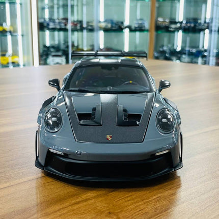 Minichamps Porsche 911 GT3 RS 2024 1:18 Diecast Model Car Grey - studio product photo of the scale model