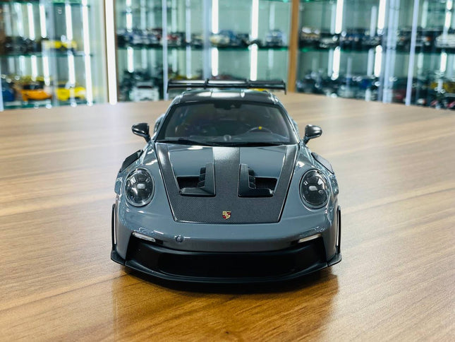 Minichamps Porsche 911 GT3 RS 2024 1:18 Diecast Model Car Grey - studio product photo of the scale model
