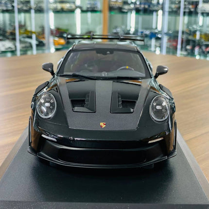 Minichamps Porsche 911 992 GT3 RS 2023 1:18 Diecast Model Black - studio product photo of the scale model