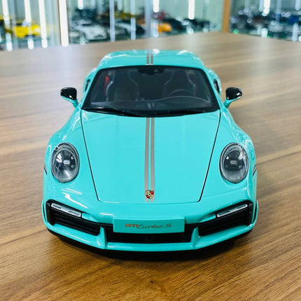 Minichamps Porsche 911 Turbo S Coupe Sport Design 2021 1/18 Diecast Green - studio product photo of the scale model
