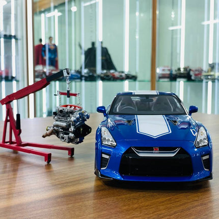 MotorHelix 1/18 Nissan GT-R R35 50th Anniversary Wangan Blue Diecast Model - studio product photo of the scale model