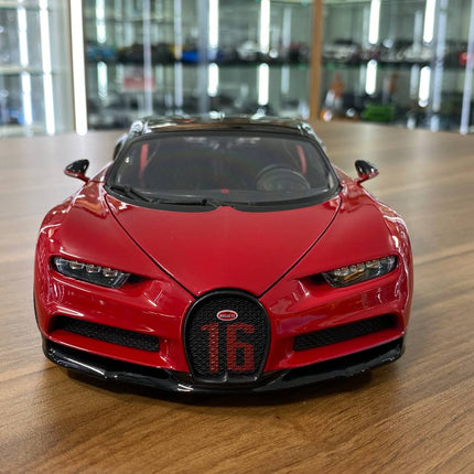 Bburago 1/18 Bugatti Chiron Sport "16" Red and Black Diecast Model Car - studio product photo of the scale model