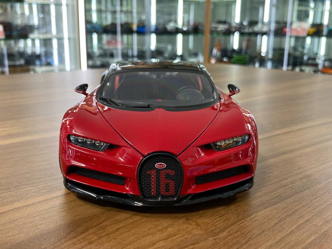 Bburago 1/18 Bugatti Chiron Sport "16" Red and Black Diecast Model Car - studio product photo of the scale model