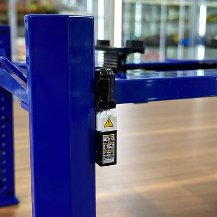 GreenLight 1/18 Four-Post Lift Adjustable Display Diecast Blue - studio product photo of the scale model