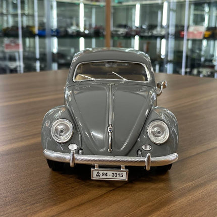 Bburago 1/18 Volkswagen Kafer Beetle (1955) Grey Diecast Model Car - studio product photo of the scale model