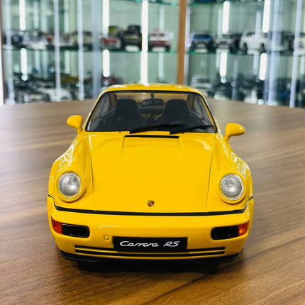 Solido Porsche 911 3.8 RS 1:18 Diecast Model Car Yellow - studio product photo of the scale model