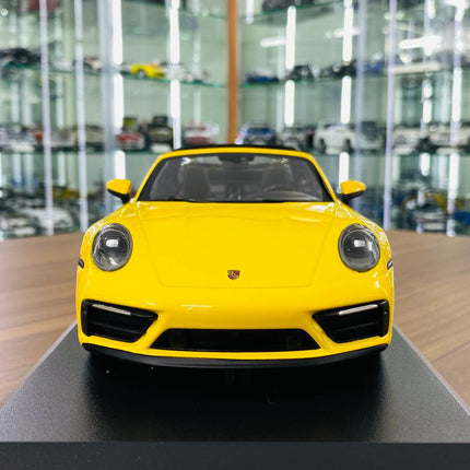 Minichamps 1/18 Porsche 911 (992) Targa 4 GTS 2021 Yellow Resin Model Car - studio product photo of the scale model