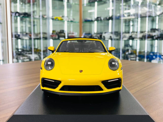 Minichamps 1/18 Porsche 911 (992) Targa 4 GTS 2021 Yellow Resin Model Car - studio product photo of the scale model