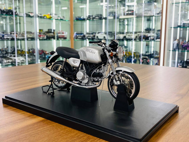 AutoArt Ducati GT 1000 Silver 1:18 Diecast Model Motorcycle - studio product photo of the scale model
