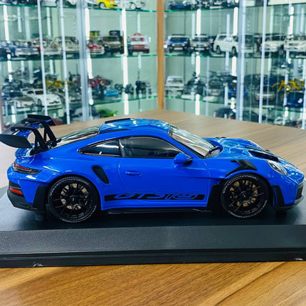 Minichamps 1/18 Porsche 911 (992) GT3 RS 2023 Diecast Model Blue - studio product photo of the scale model