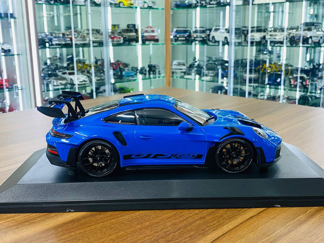 Minichamps 1/18 Porsche 911 (992) GT3 RS 2023 Diecast Model Blue - studio product photo of the scale model