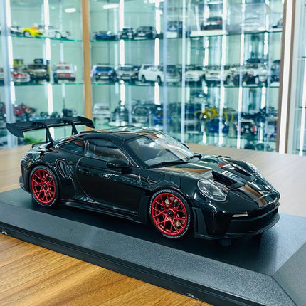 Minichamps Porsche 911 992 GT3 RS 2023 1:18 Black with Red Wheels Diecast Model - detailed collector display model