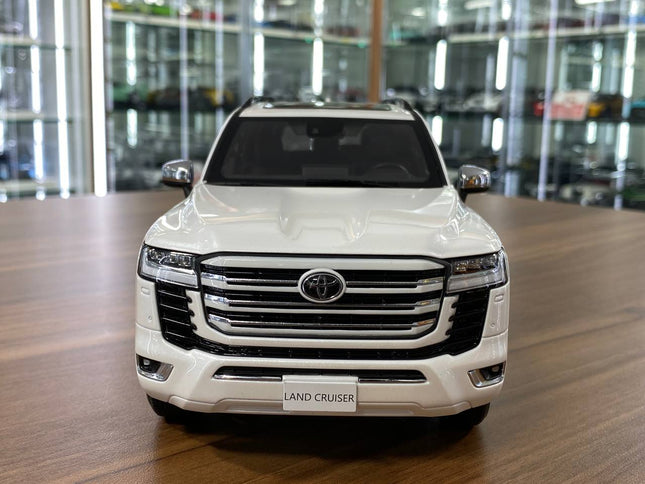 LCD Model Toyota Land Cruiser LC300 ZX White Full Opening 1:18 Diecast Model Car - studio product photo of the scale model