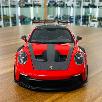 Minichamps Porsche 911 (992) GT3 RS Weissach Package 2022 1/18 Diecast Model Red - studio product photo of the scale model