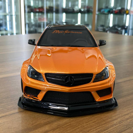 GT Spirit 1:18 Mercedes-Benz AMG C63 Coupe W204 LB Works Resin Model Orange - studio product photo of the scale model