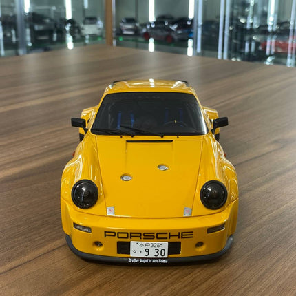 GT Spirit 1:18 Porsche 911 Carrera RSR Homage 1974 Diecast Model Car Yellow - studio product photo of the scale model