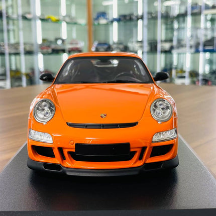 Minichamps Porsche 911 GT3 RS 2007 1:18 Diecast Model Car Orange - studio product photo of the scale model