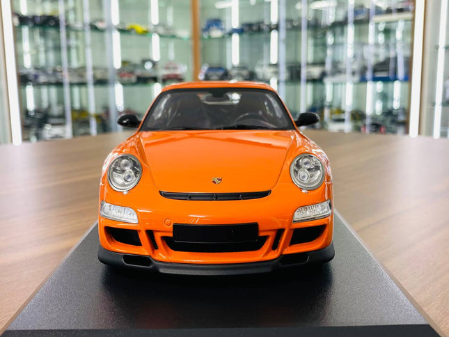 Minichamps Porsche 911 GT3 RS 2007 1:18 Diecast Model Car Orange - studio product photo of the scale model