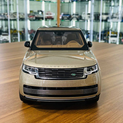 LCD Model Land Rover Range Rover 2022 Gold 1:18 Diecast Model Car - studio product photo of the scale model