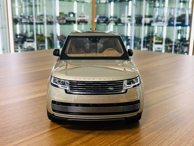 LCD Model Land Rover Range Rover 2022 Gold 1:18 Diecast Model Car - studio product photo of the scale model