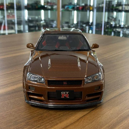 MotorHelix 1/18 Nissan Skyline GT-R R34 Customized Diecast Model Metallic Bronze - studio product photo of the scale model