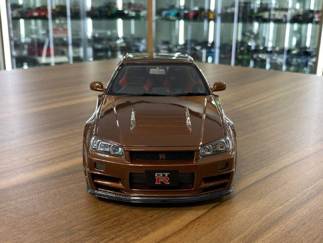 MotorHelix 1/18 Nissan Skyline GT-R R34 Customized Diecast Model Metallic Bronze - studio product photo of the scale model