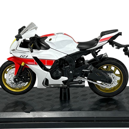 1:18 scale diecast Yamaha R1 model motorcycle in white with red accents on display stand