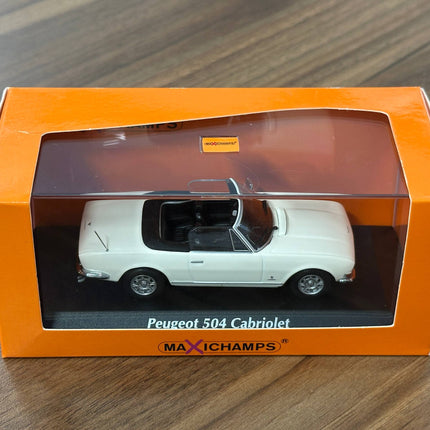 1/43 Diecast Maxichamps MPeugeot 504 Cabriolet 1977 in White - studio product photo of the scale model
