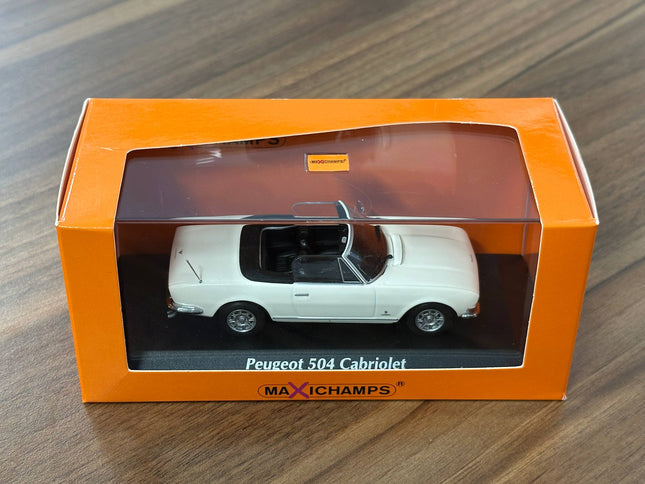 1/43 Diecast Maxichamps MPeugeot 504 Cabriolet 1977 in White - studio product photo of the scale model